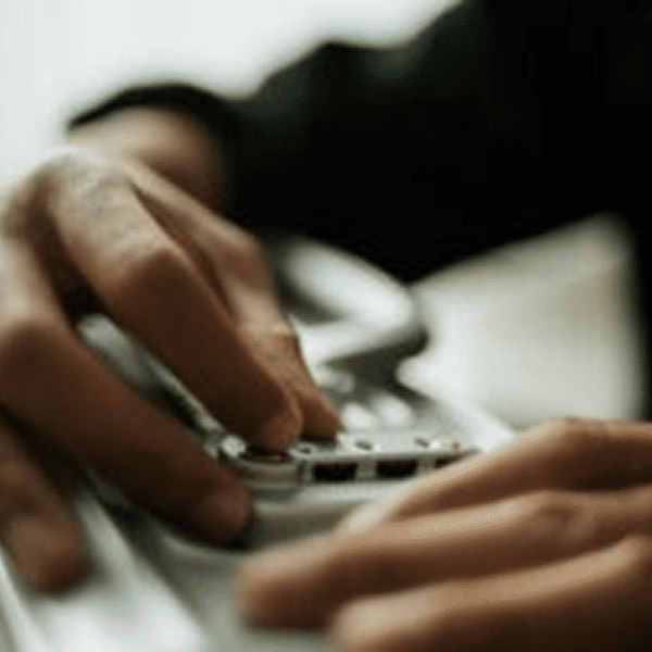 Person working on computer keyboard
