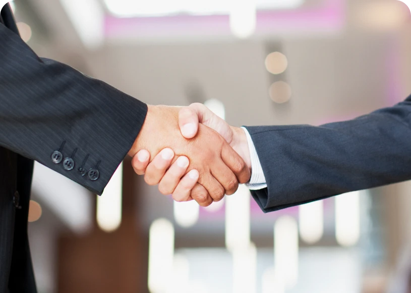 Business handshake in modern office