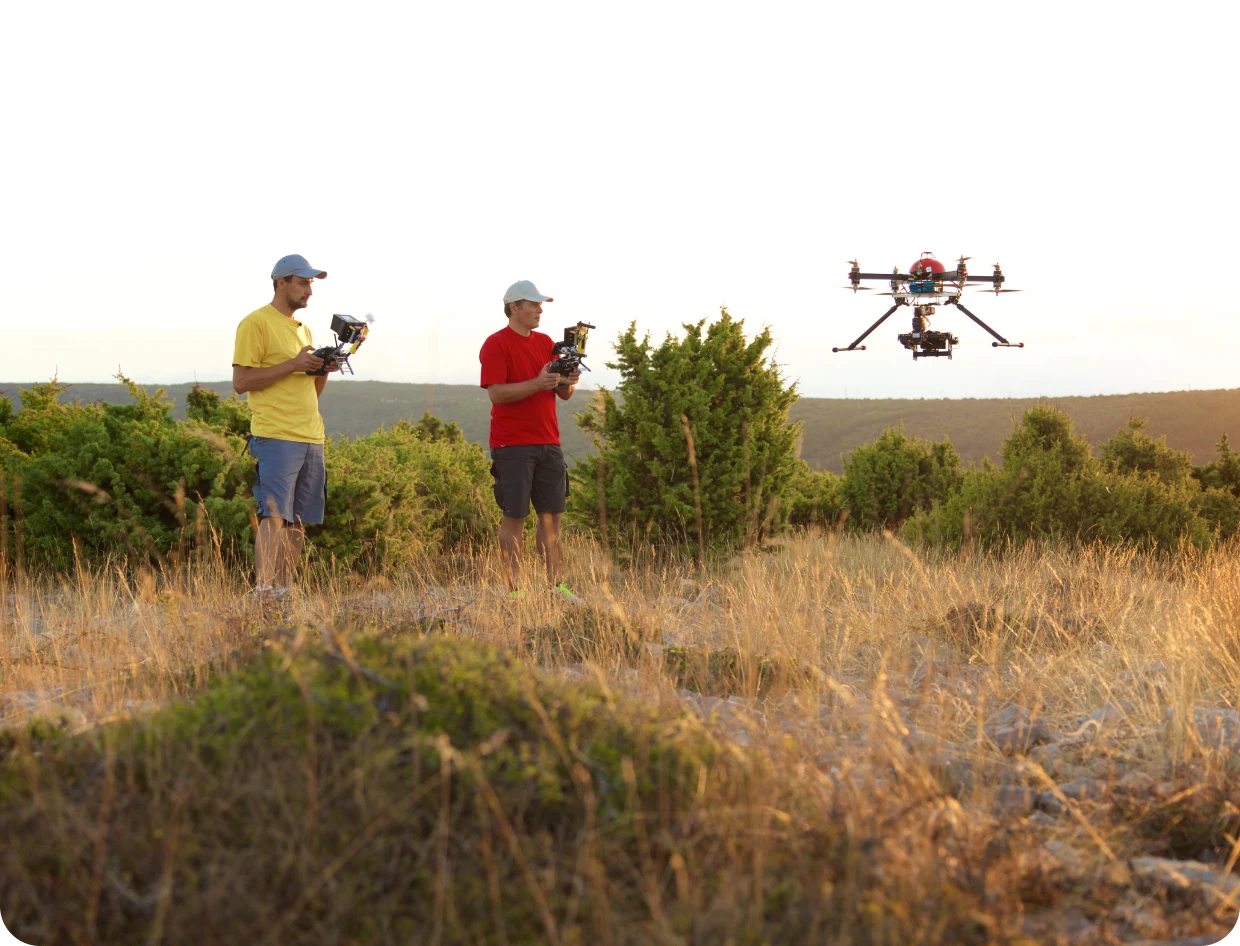 Drone operators in open field