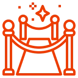 Red carpet icon with stanchions and stars