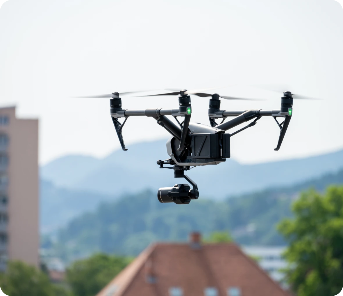 Drone flying over houses and trees